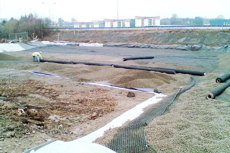Leca® LWA provided contractors for groundworks at the site of a new international sports village with a lightweight solution for a new road embankment over a former refuse tip subject to settlement.