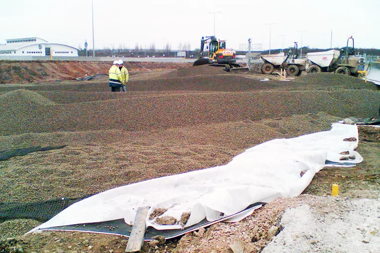 Leca® LWA provided contractors for groundworks at the site of a new international sports village with a lightweight solution for a new road embankment over a former refuse tip subject to settlement.